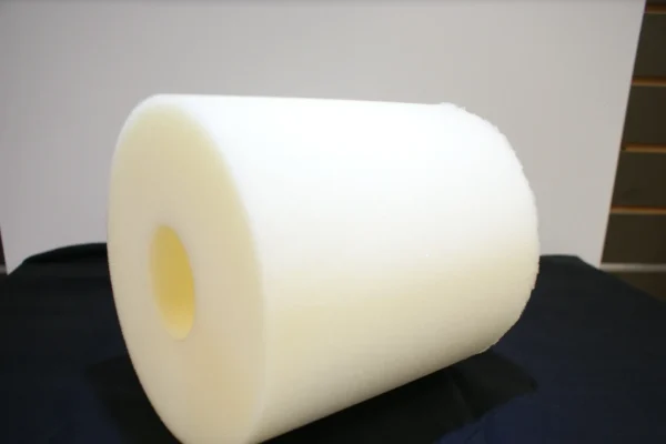 A roll of white foam sitting on top of a table.