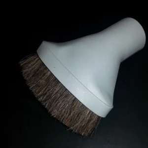 A white vacuum cleaner head with brown brush.