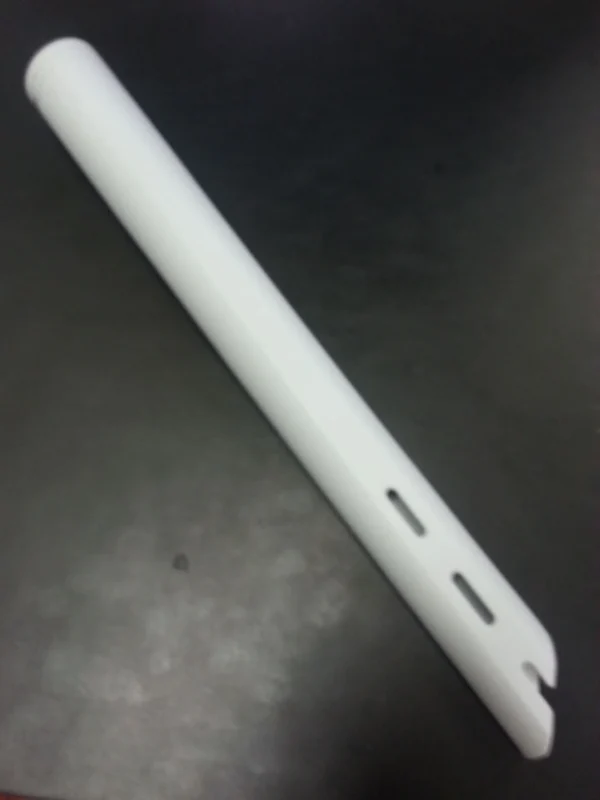 A white plastic tube with holes in it.
