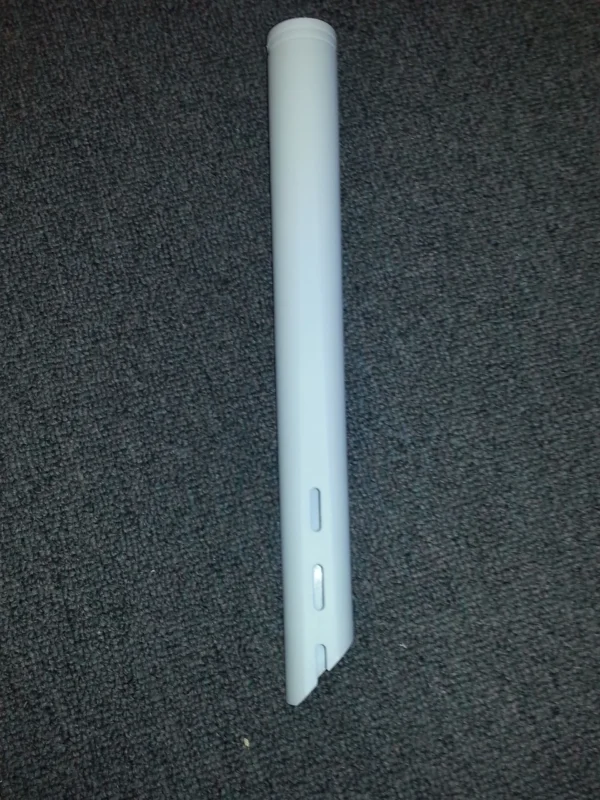 A white plastic pole sitting on top of the floor.