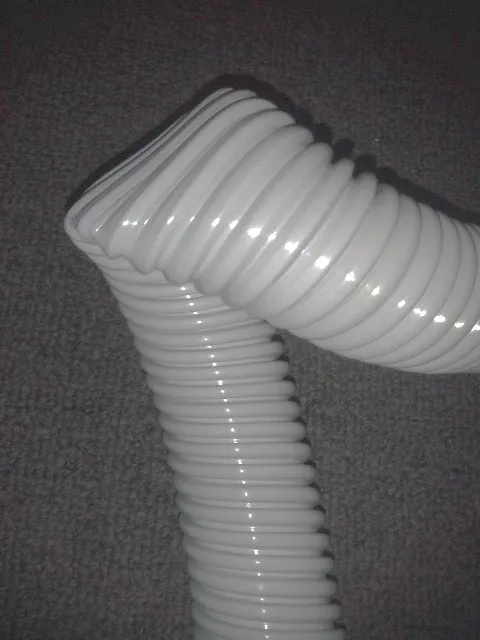 A white hose is bent to the side.