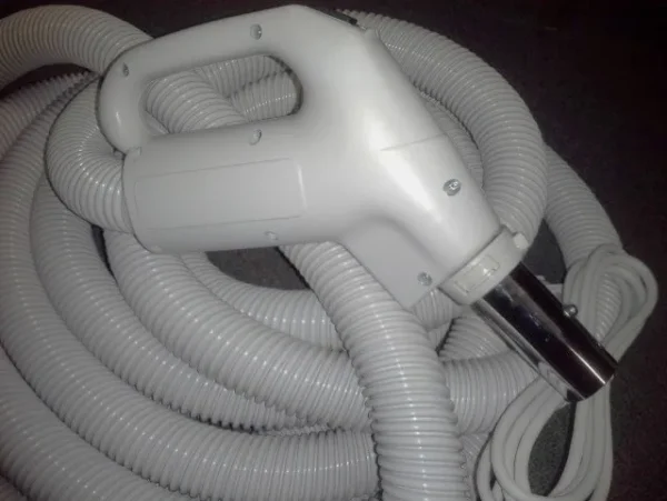 A white hose with a hair dryer on it.