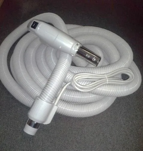 A white hose with two different attachments on it.