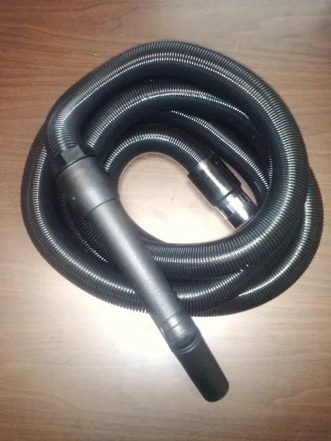 A black hose is on the floor