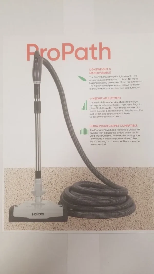 A vacuum cleaner is on display next to a hose.