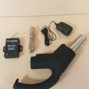 A black device with wires and a charger.