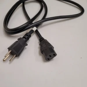 A black cord with two plugs on top of it.
