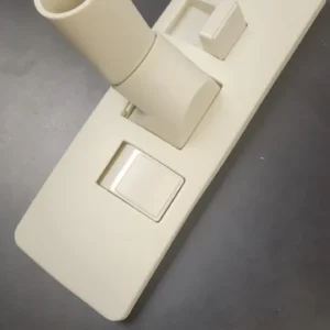 A white light switch on the wall.
