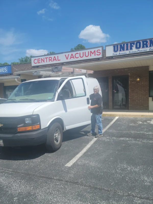 A man standing in front of a van.